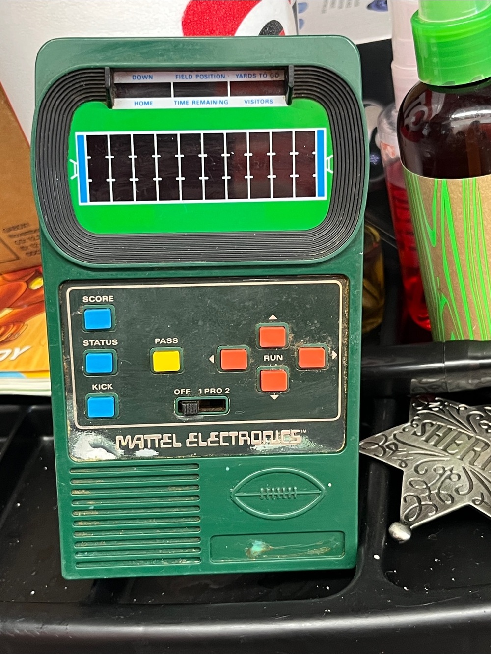 Mattel Green Handheld Electronic Football Game with Blue Yellow Orange Buttons